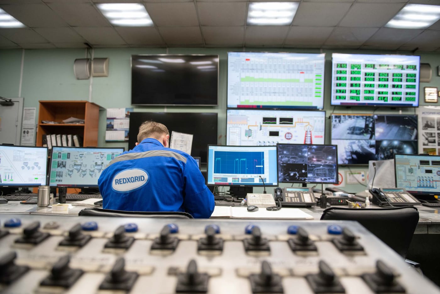 Engineer at a control-room desk