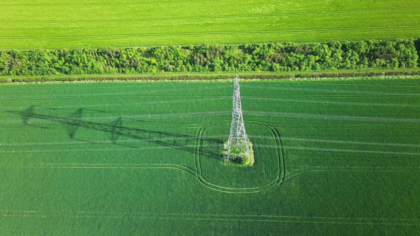 Transmission tower and its shadow seen from the air