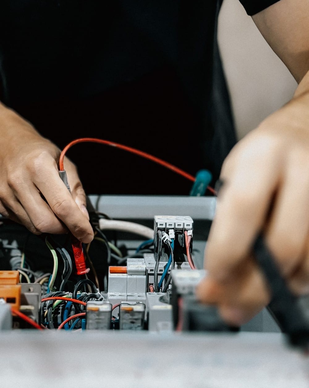Technician taking electrical measurements
